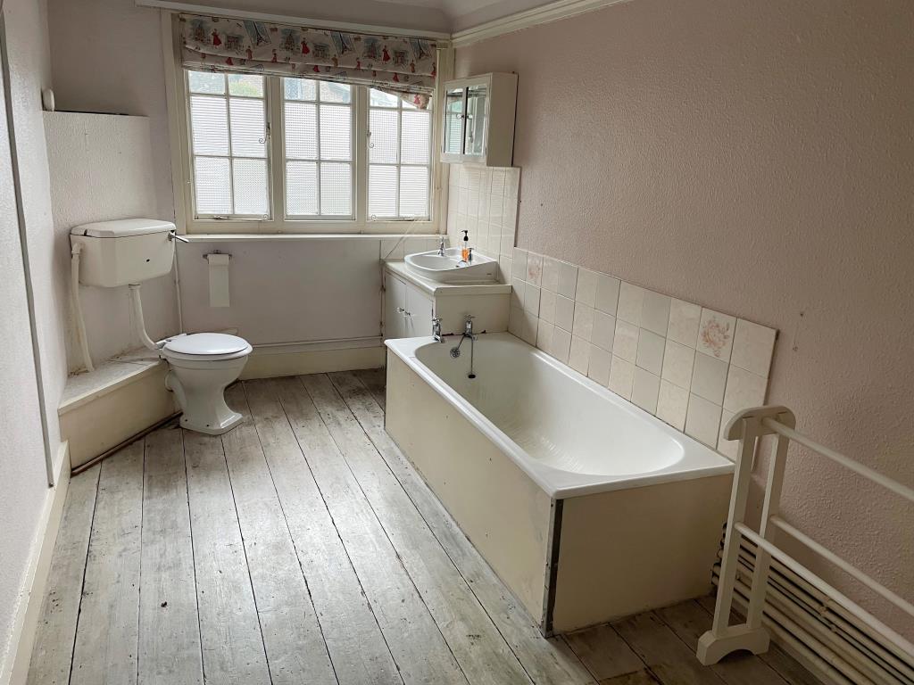 Lot: 24 - PART-POSSESSION INVESTMENT WITH POTENTIAL PRODUCING £20,820 PER ANNUM - White bathroom suite and WC